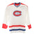 LOT 53: MAURICE RICHARD, JEAN BELIVEAU AND JACQUES DEMERS AUTOGRAPHED WHITE CCM JERSEY